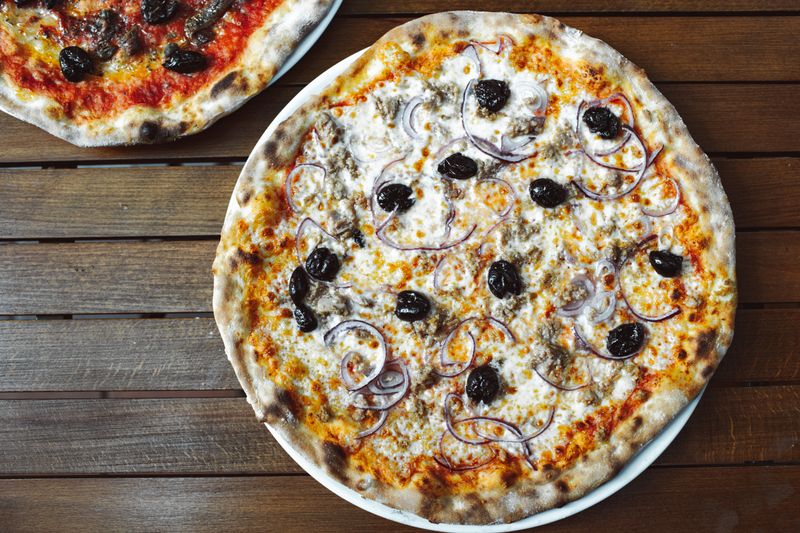 BBQ chicken pizza with smoky sauce and red onion